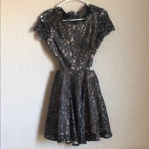 BEBE charcoal lace mini dress with cutouts
